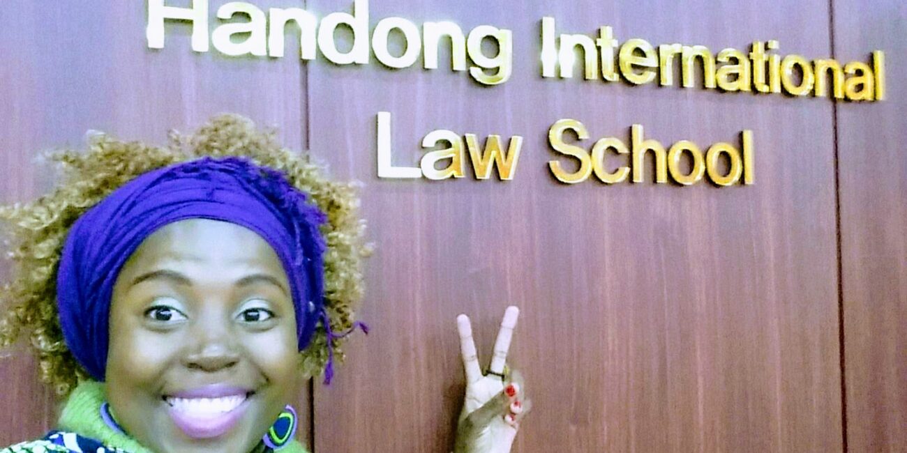Sarah pointing law school wall inscription